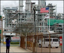 A student snaps a photo of the ExxonMobil refinery.