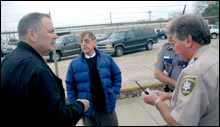 Willie Fontenot (center) surrounded by ExxonMobil security guards.