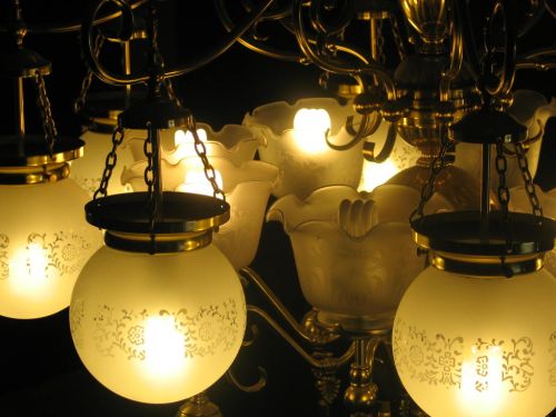 CFL bulbs in a chandelier.