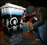 The Roots: Band member autographing compost bins