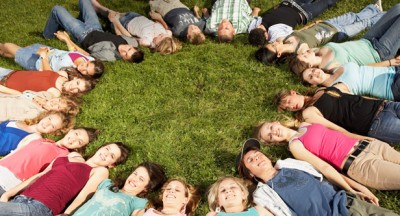 kids lying on grass