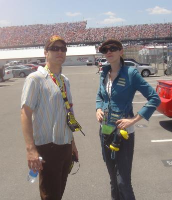 Little and her NASCAR-savvy guide in front of the grandstands.