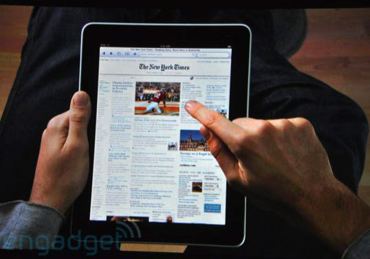 iPad in lap with New York Times on screen