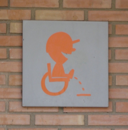 peeing on bricks sign