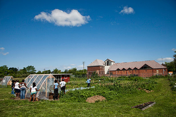 Girls building greenhouse