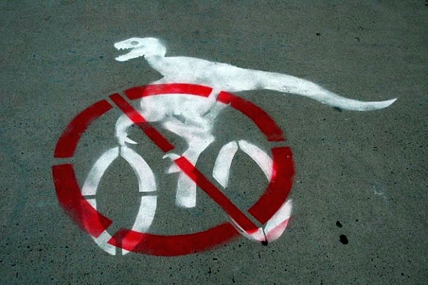 no dinosaurs on bikes graffiti