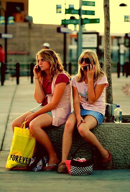teen girls talking on cell phones