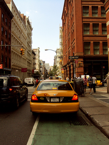 Taxi blocking NYC bike lane.