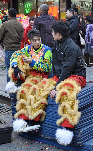 Young men in costume at Lunar new Year celebration.