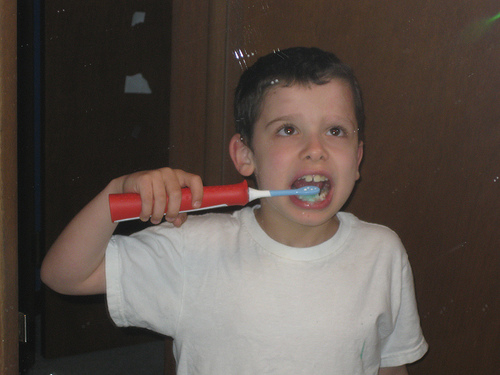 Boy with toothbrush.