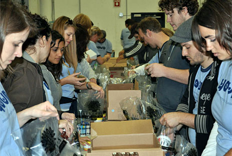 Volunteers packing food