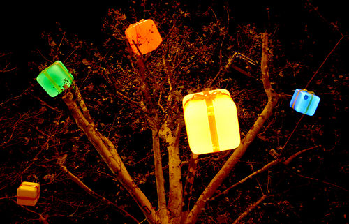 Lit-up gifts in a tree.