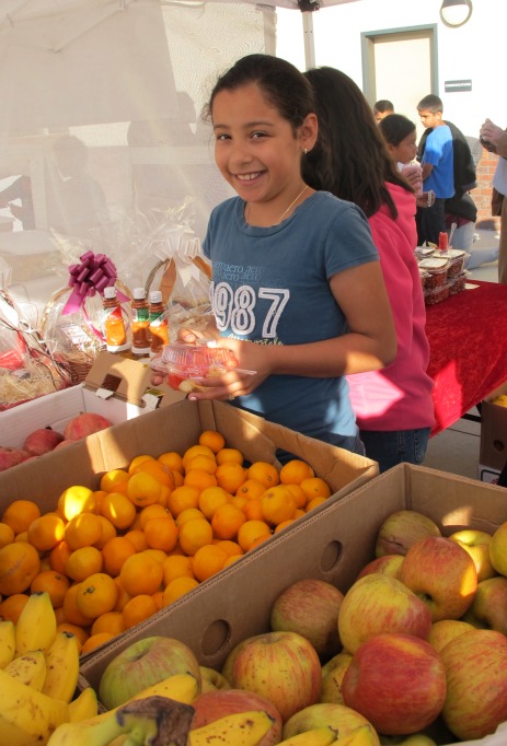 Ceres kids buying fruit at stand