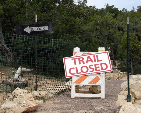 "trail closed" sign