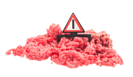 ground meat with a caution sign