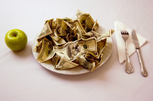 pile of money on a plate