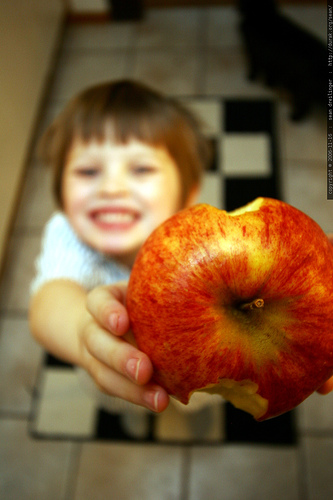 Kid with an apple.