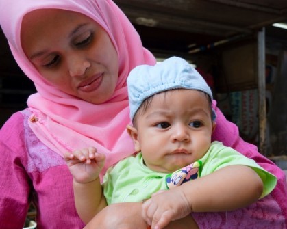 mother in headscarf and child