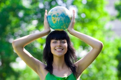 happy woman holding globe