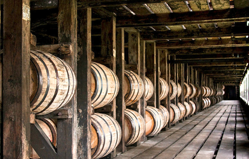 barrels of aging bourbon