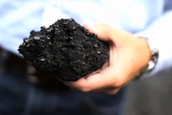 hand-holding-lump-of-coal