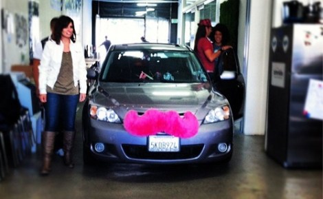 The detachable pink mustache alerts ride-seekers that this ride is a Lyft.