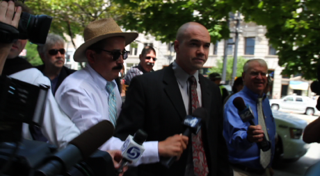 Tim DeChristopher is followed by reporters as he walks to the courthouse before sentencing. 