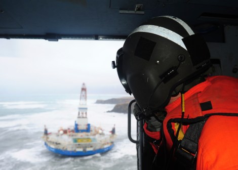Rear Adm. Thomas Ostebo, commander, 17th Coast Guard District and D17 Incident Management Team commander, observes the conical drilling unit Kulluk from an MH-60 Jayhawk helicopter during a second overflight Tuesday, Jan. 1, 2013.