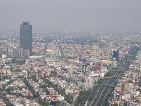 The Pemex headquarters towers over Mexico City on a smoggy day in 2004