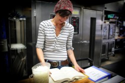 Christina Waller at work in the coop's central kitchen.