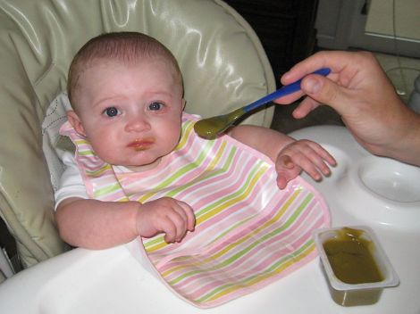 800px-Baby_eating_baby_food