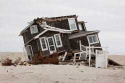 Some waterfront residents would prefer to risk storm surge destruction such as this, in unprotected Mantoloking after Superstorm Sandy, than lose their views.