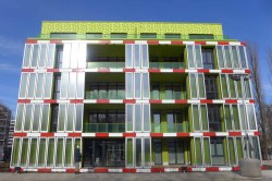 Green paint and panels filled with green algae provide an environmental aesthetic for an environmentally friendly building. 