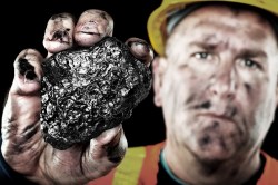 A coal worker holding the actual heart of Peabody Energy chief executive Stephen Howlett