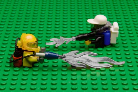 Lego men spraying lego herbicide on a lego field.