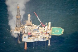 Natural gas surrounding a drilling rig Tuesday before it exploded.