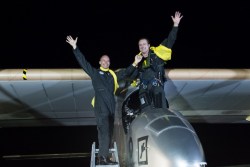 Solar Impulse's pilots, Andre Borschberg and Bertrand Piccard, celebrate after reaching New York.