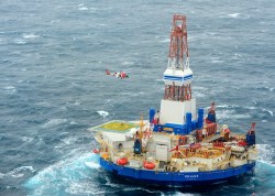Workers evacuated after Shell's exploratory oil rig ran aground. Turns out it was also in violation of pollution laws.