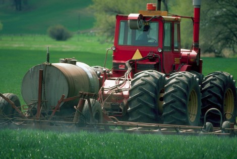 Tractor Spraying Herbicide on Field
