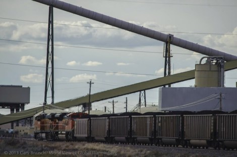 A westbound 115-car train packed with Powder River Basin coal passing through the Wyodac Power Plant outside of Gillette.