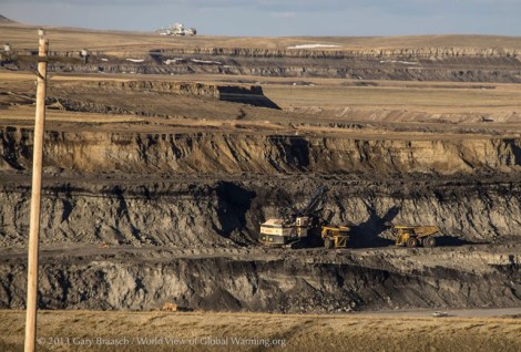 Power shovel at work in the Caballo mine, owned by Peabody Energy Corporation, loading coal onto trucks from a coal seam more than 200 feet below the prairie surface. Under state and federal leases, mines are expanding through the grassland soils and surface rock, spitting it out as piled-up spoils and imperfectly restored land.
