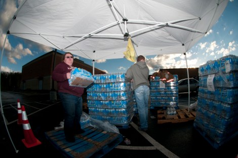 Volunteers handing out bottled water in West Virginia. Don't even get me started on all the plastic.