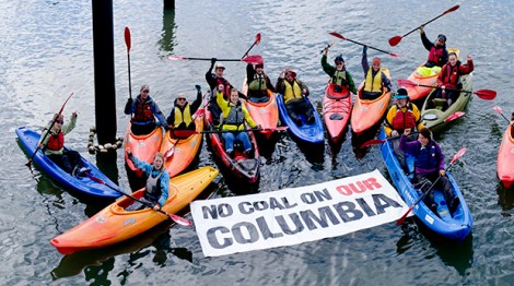 Kayaking activists paddle against coal on the part of the Columbia River where Ambre hopes to transfer coal from barges to ocean going vessels
