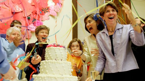 Original Plaintiff couples (R-L) Hillary and Julie Goodridge, their daughter Annie, 9, lawyer Mary Bonauto and an unidentified couple react as streamers are set off during a First Year Anniversary Celebration of the legalization of Gay Marriage at Unitarian Universalist Association Headquarters in Boston, Massachusetts, May 17, 2005.