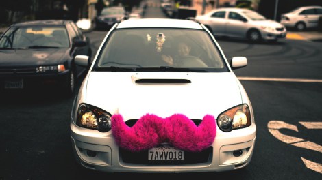 car with pink mustache