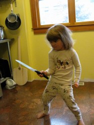 A, let's face it, totally gratuitous, but pretty funny picture of a kid with a knife. I dub her Knifegirl.