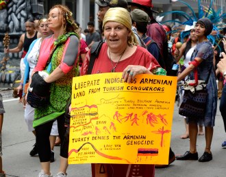 woman with sign about Armenian genocide