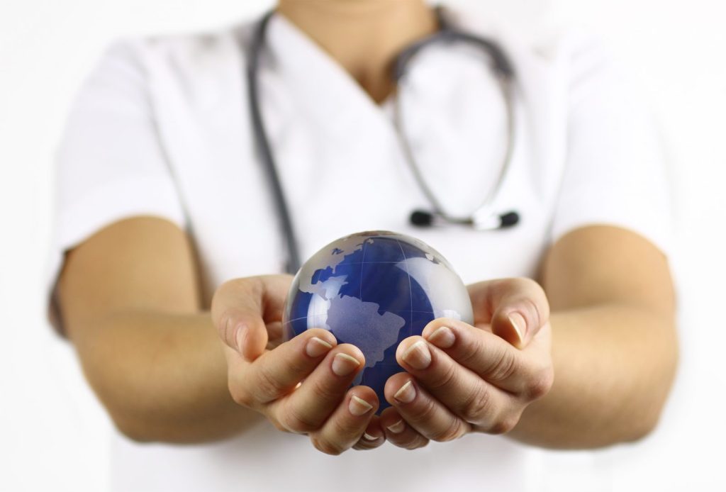 Doctor holding globe