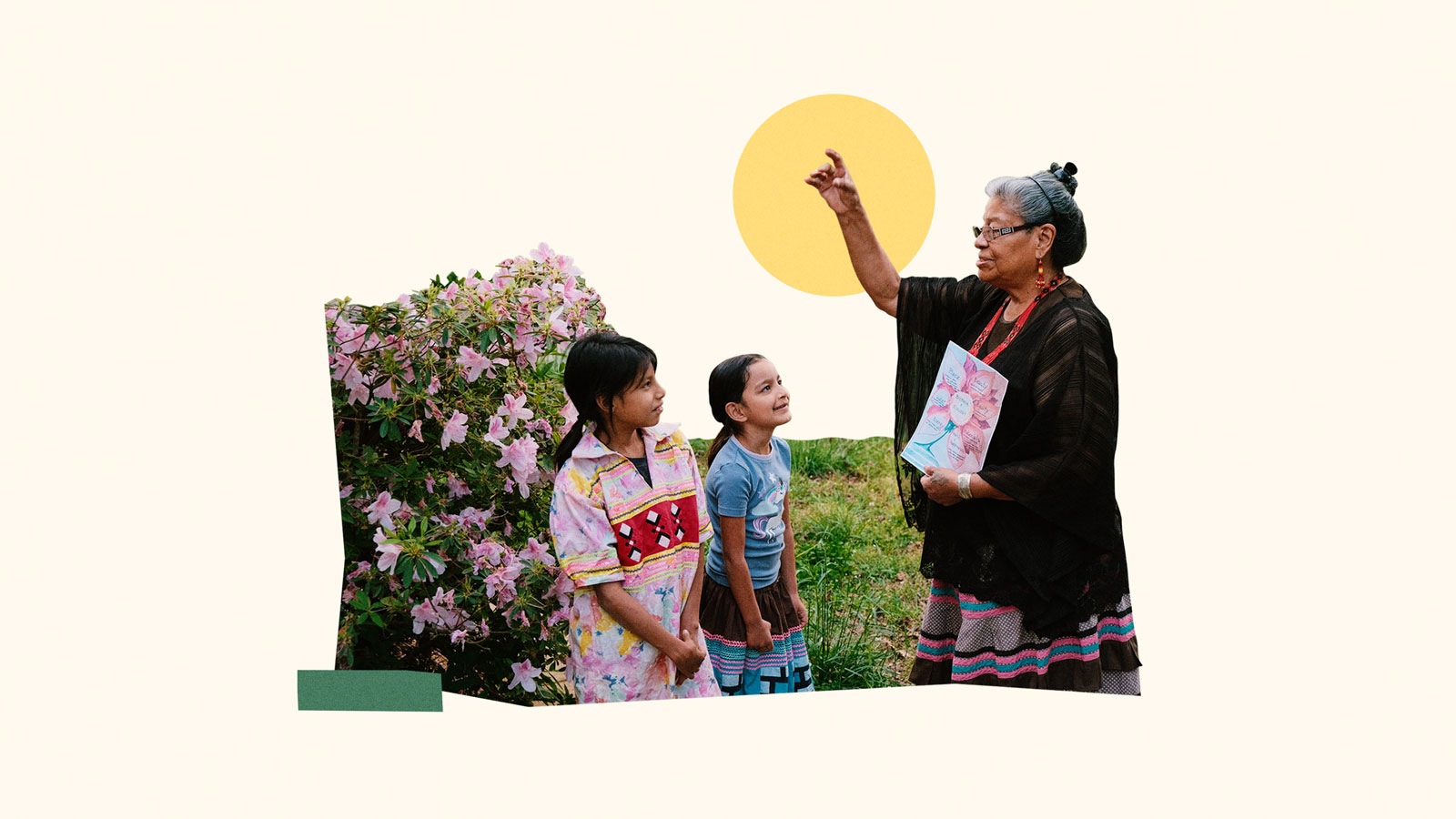 Older person teaching children about meaning of 7 petals in Maskoke language