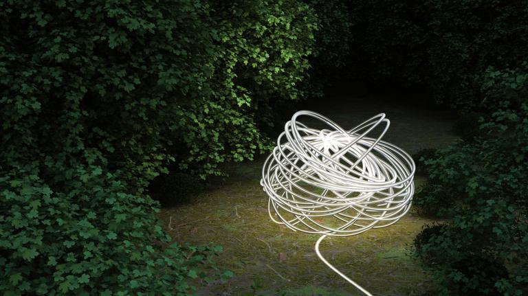 A ball of glowing thread in the forest